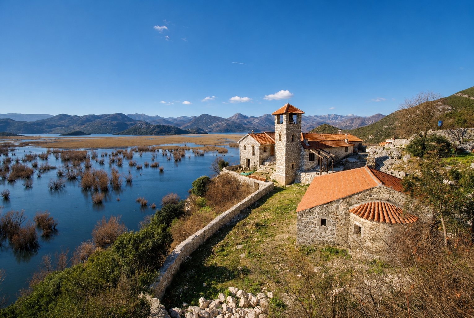 Monastery Kom on Lake Skadar with mountains in background